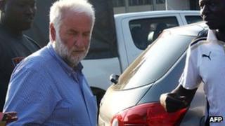 Former head of French oil giant Elf Loik Le Floch-Prigent (L) arrives at a Togolese court in Lome on 17 September 2012