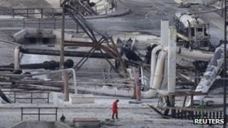 Burnt cars and gas storage tanks at the Pemex plant in Reynosa on 18 September 2012
