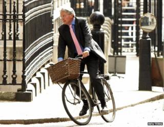 Andrew Mitchell arriving at Downing Street on his bicycle, May 2011