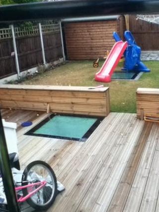 Roof lights in the decking and under the slide betray the presence of the extension