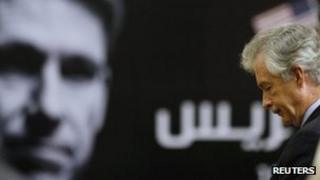 US Deputy Secretary of State William Burns stands in front of a picture of slain US ambassador to Libya Christopher Stevens (20 Sept 2012)