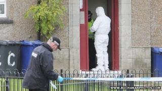 police forensic officer at the scene