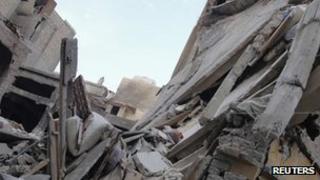 Archive photo of damaged buildings in Homs, 30 September 2012