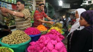 Market vendors at a stall in Hebron Old City