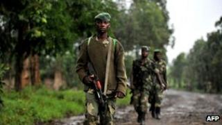 M23 rebel soldiers patrol near Rutshuru, 17 October 2012