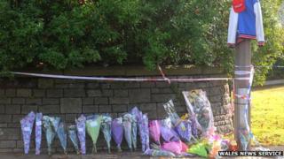 Floral tributes outside Ely fire station
