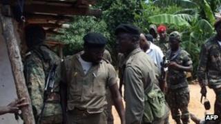 Soldiers inspect aftermath at barracks
