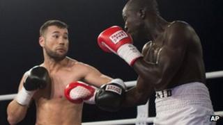 German-born Afghan boxer Hamid Rahimi (left) and Tanzanian Said Mbelwa in the ring