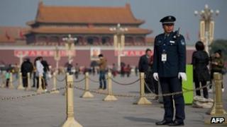 A security guard stands on Tiananmen Square in Beijing, 29 Oct 2012