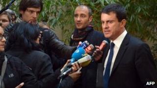 French Interior Minister, Manuel Valls (R) answers journalists' questions, on October 31, 2012 in Paris,