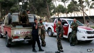 Libyan security forces stand guard near the parliament building in Tripoli, 2 November 2012