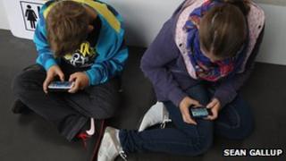 Children playing games on smartphones