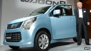 Chairman of Japanese automaker Suzuki Motor, Osamu Suzuki introduces the company's new compact car