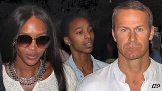 Supermodel Naomi Campbell walks with her boyfriend Russian billionaire Vladimir Doronin as they leave his birthday bash in Rajasthan.