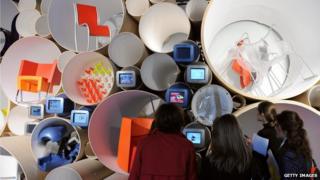 Visitors to the Centre Pompidou, in Paris, look at work by industrial designer Ron Arad