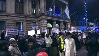 Supporters gather outside the town hall
