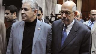 Egyptian opposition leaders Hamdeen Sabahi, second left, and Mohamed ElBaradei, center, arrive for a press conference in Cairo, Egypt, Wednesday, Dec. 5, 2012.