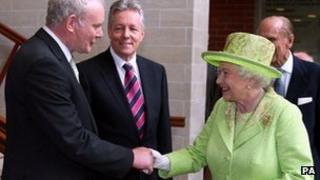 The Queen and Sinn Fein's Martin McGuinness shake hands in Belfast