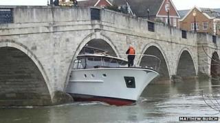 Boat stuck under Chertsey Bridge