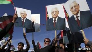 Archive photo of Palestinians holding placards of Mahmoud Abbas, 2 December 2012