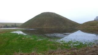 Floodwater surrounds Silbury Hill in Wiltshire