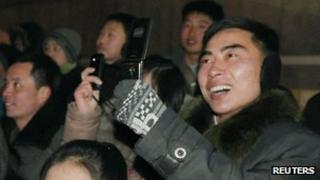 North Koreans take photos on mobile phones at New Year in Pyongyang (1 Jan 2013)