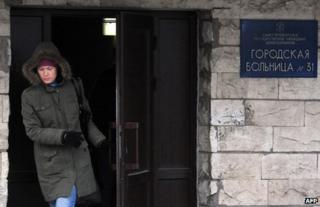 A woman leaves St Petersburg's Hospital No 31, 22 January