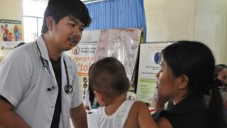 Ryan Almirez with a patient
