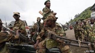 Rebels sit in a truck as they patrol a street in Sake, eastern DR Congo - 21 November 2012