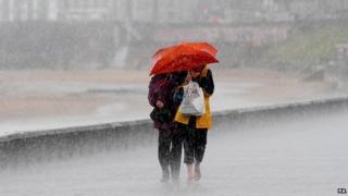 People in rain (library photo)