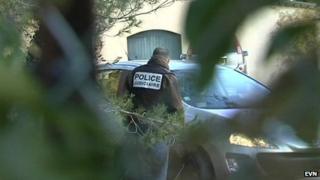 Police outside the house were the murder suspect lives in Nimes