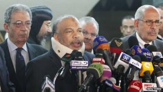 Saad al-Katatni, head of the Egyptian Muslim Brotherhood's Freedom and Justice party, talks during a news conference next to former Egyptian foreign minister Amr Moussa (L) and Egyptian liberal politician Mohamed ElBaradei (R)