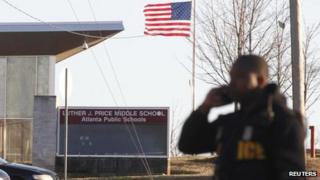Atlanta policeman outside Price Middle School (31 Jan)