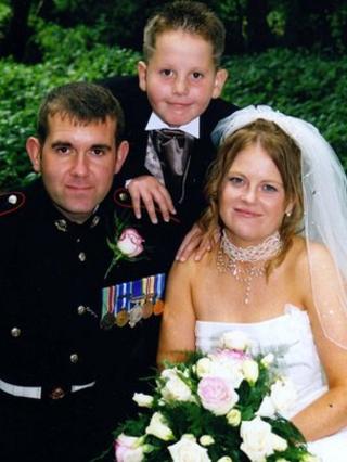 Sgt Steve Johnson and Staff Sergeant Karen Johnson, with Karen's son