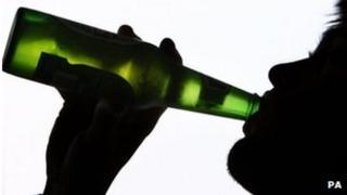 Person drinking from bottle