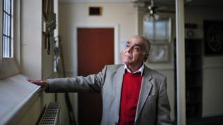Mohammad Qidwai, one of the founding trustees of the mosque, looks up towards the windows of the main hall