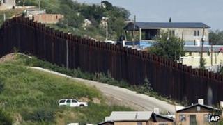 US Border Patrol vehicle in Arizona keeps watch along the fence on the border with Mexico. File photo