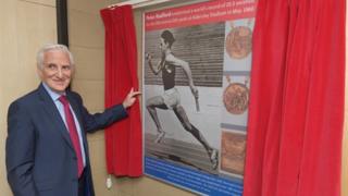 Peter Radford with the mural