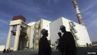 Iranian workers stand in front of the Bushehr nuclear power plant, about 1,200 km (750 miles) south of Tehran, in this October 2010 file photo