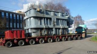 The generator transformer placed onto a low loader for transporting.