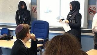 Muslim pupils speaking to a Jewish class