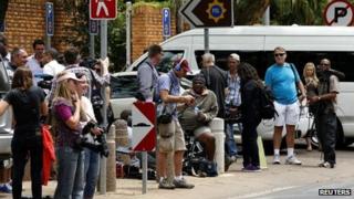 Members of the media wait for Oscar Pistorius outside the Brooklyn police station in Pretoria (25 February 2013)
