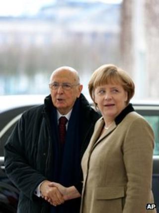 German Chancellor Angela Merkel greets Italian President Giorgio Napolitano in Berlin, 28 March