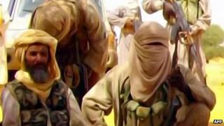 This Al-Andalus image grab taken on September 30, 2010 from a video released today shows Abu Zeid (L), also known as Abid Hammadou, posing with fighters of al-Qaeda in the Islamic Maghreb (AQIM)