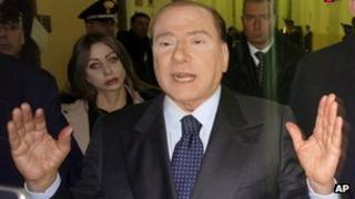 Silvio Berlusconi leaves a Milan court on 1 March 2013