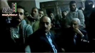 Frame from amateur video purported to show Raqqa governor Hassan Jalili (right) alongside provincial Baath party chief Suleiman Suleiman