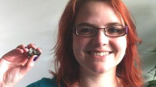 Elizabeth Pearson with the meteorite fragment