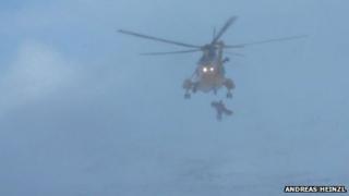 Helicopter airlifting fallen climber