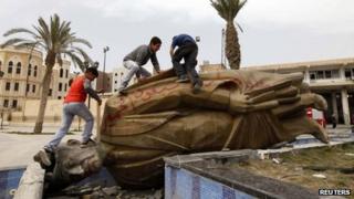 statue of Hafez al-Assad after being torn down in Raqqa, Syria