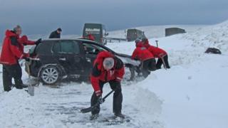 Kirkby Stephen Mountain Rescue Team digging out trapped vehicles